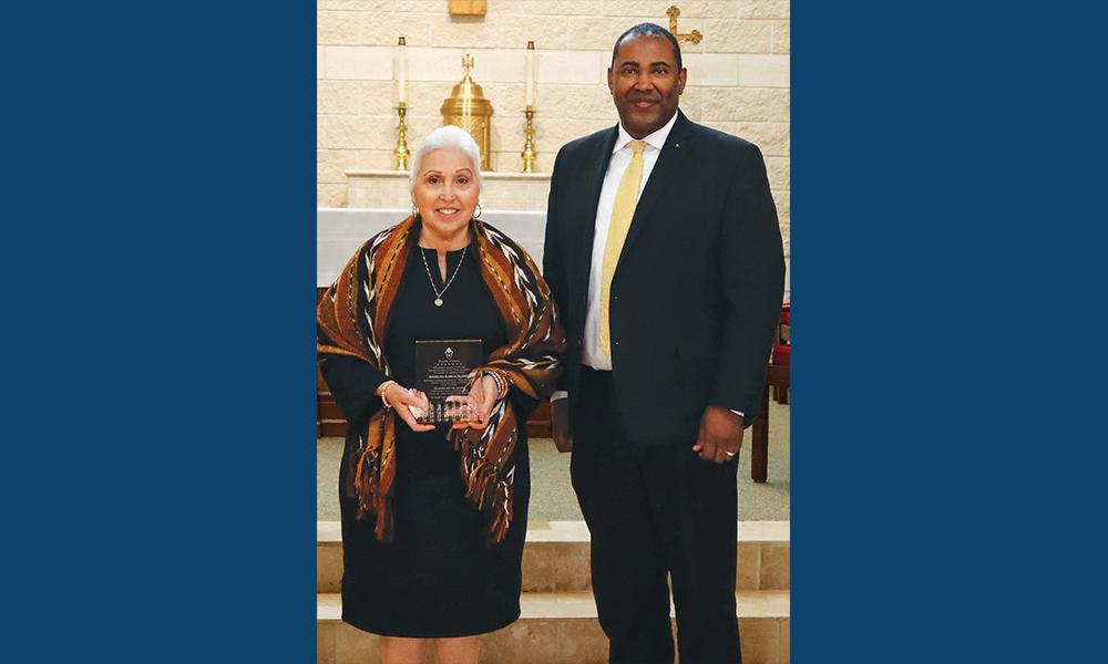 DeKarlos Blackmon presented the Drum Major for Justice Award to Angelita Garcia Alonzo on Jan. 14 at St. Michael’s Catholic Academy in Austin. (Photo by Shelley Metcalf)