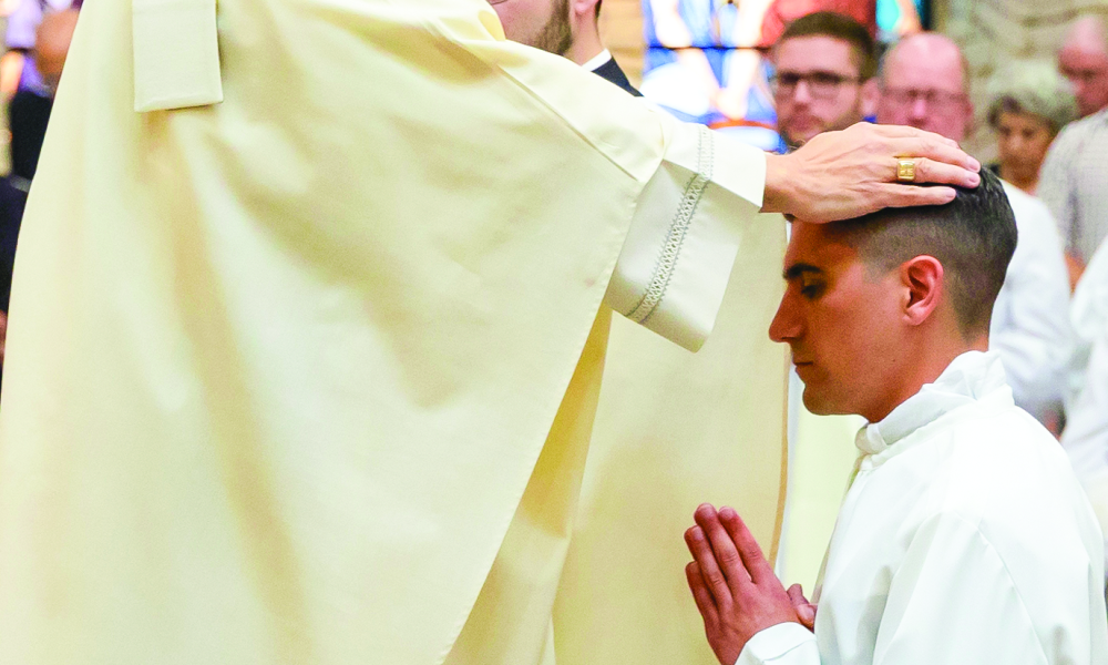 Bishop Joe Vásquez laying hands on Matthew Jewell during his ordination