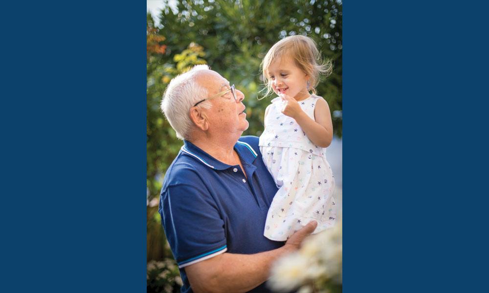 Grandfather holding his granddaughter