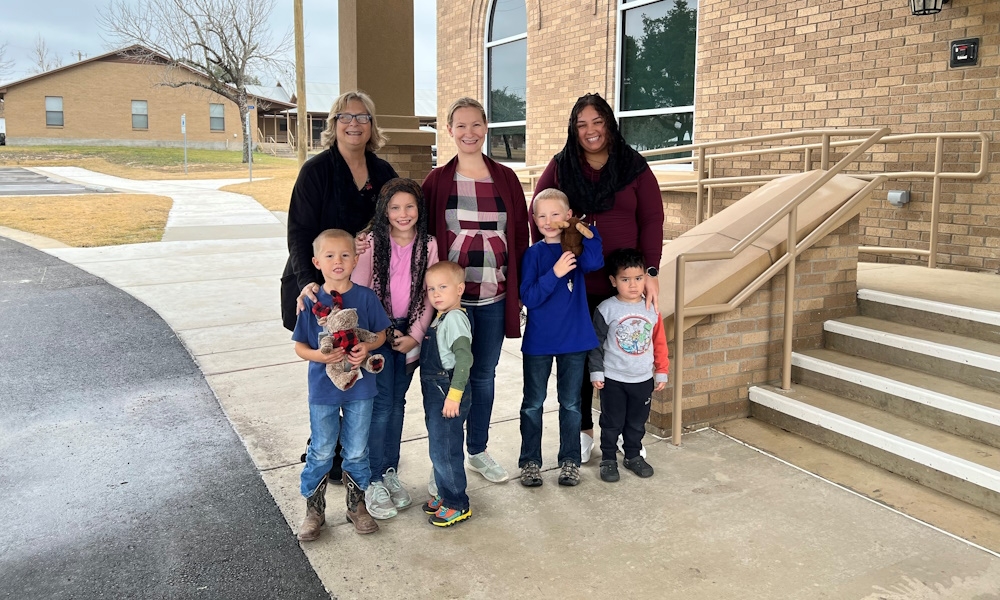 Moms and children gather to pray and play