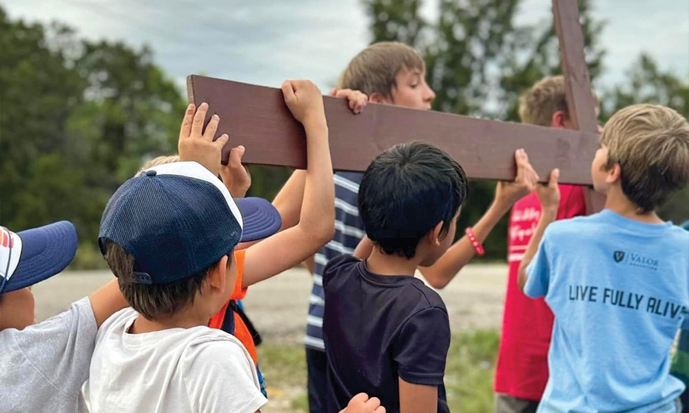 Walking with the cross through the streets of Austin