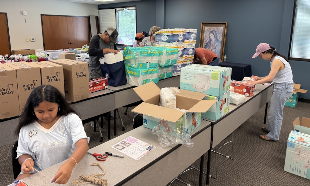 Catholic Charities continues to help survivors of last year’s floods