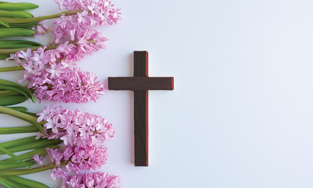 Wood cross with pink flowers